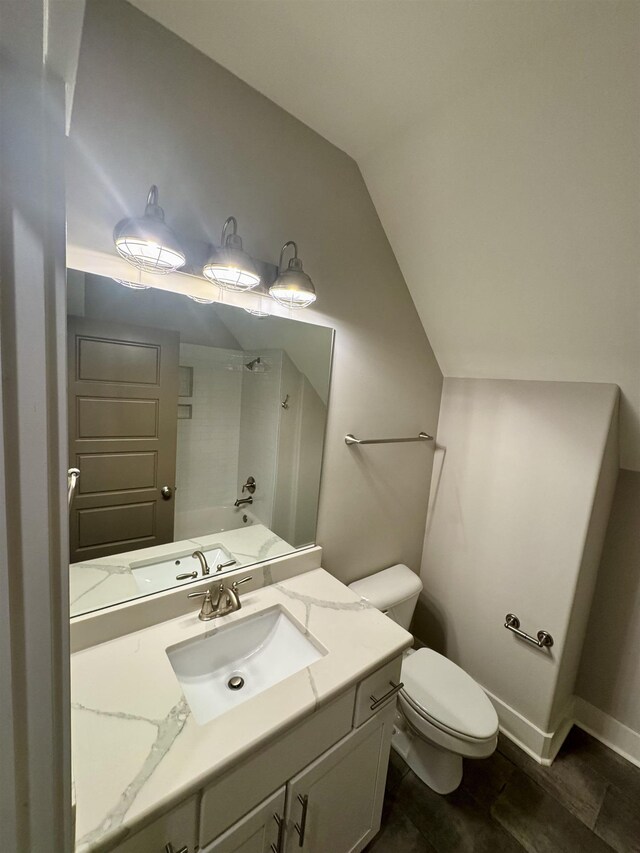 7148 Donnington Dr, Germantown, TN 38138 - bathroom featuring vanity, vaulted ceiling, and tub / shower combination