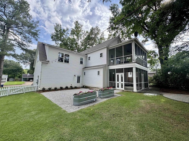 7148 Donnington Dr, Germantown, TN 38138 - back of property featuring a sunroom, roof with shingles, and a vegetable garden