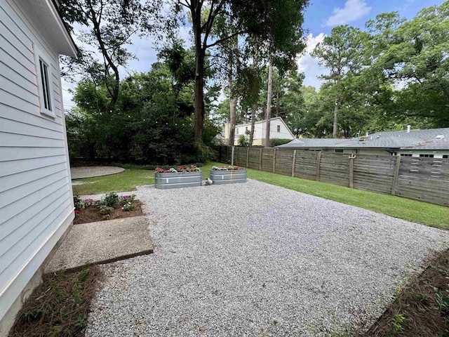 7148 Donnington Dr, Germantown, TN 38138 - fenced backyard with a patio and a garden