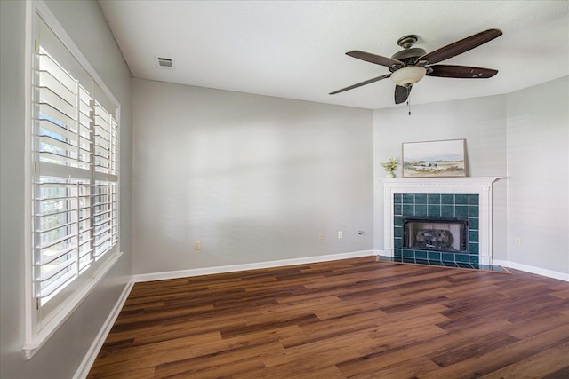 772 Breeze Way, Cordova, TN 38018 - unfurnished living room featuring wood finished floors, ceiling fan, and a tile fireplace