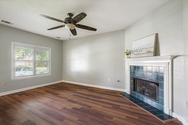 772 Breeze Way, Cordova, TN 38018 - unfurnished living room with wood finished floors, a ceiling fan, a fireplace, and a textured ceiling