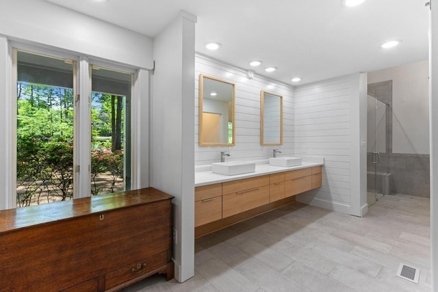 9240 Riveredge Dr, Memphis, TN 38018 - full bath with double vanity, a stall shower, and recessed lighting