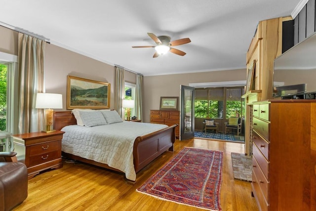9240 Riveredge Dr, Memphis, TN 38018 - bedroom with multiple windows, ornamental molding, light wood-type flooring, and a ceiling fan