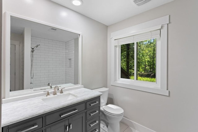 9240 Riveredge Dr, Memphis, TN 38018 - bathroom featuring vanity, tiled shower, and tile patterned floors