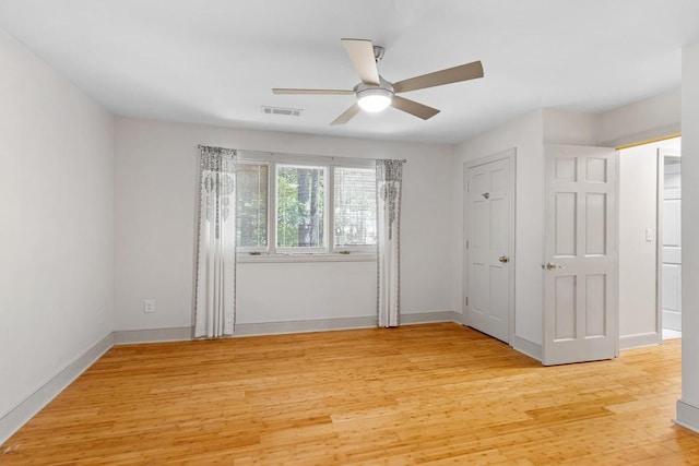 9240 Riveredge Dr, Memphis, TN 38018 - unfurnished bedroom with light wood finished floors and ceiling fan