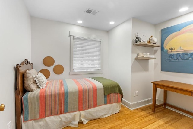9240 Riveredge Dr, Memphis, TN 38018 - bedroom with wood finished floors and recessed lighting
