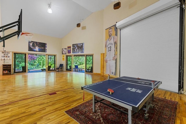 9240 Riveredge Dr, Memphis, TN 38018 - game room with high vaulted ceiling and wood finished floors
