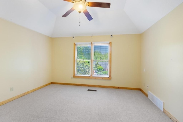 9240 Riveredge Dr, Memphis, TN 38018 - spare room featuring lofted ceiling, light carpet, and a ceiling fan