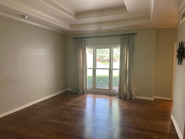 6425 Lebarrett Cv, Memphis, TN 38120 - spare room with a raised ceiling, dark wood-type flooring, and crown molding