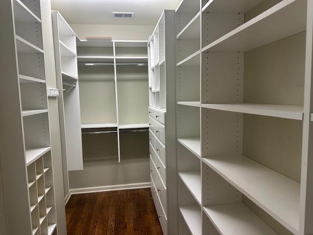 6425 Lebarrett Cv, Memphis, TN 38120 - walk in closet featuring dark wood-style floors