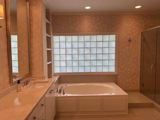 6425 Lebarrett Cv, Memphis, TN 38120 - full bathroom with wallpapered walls, a garden tub, vanity, a stall shower, and healthy amount of natural light