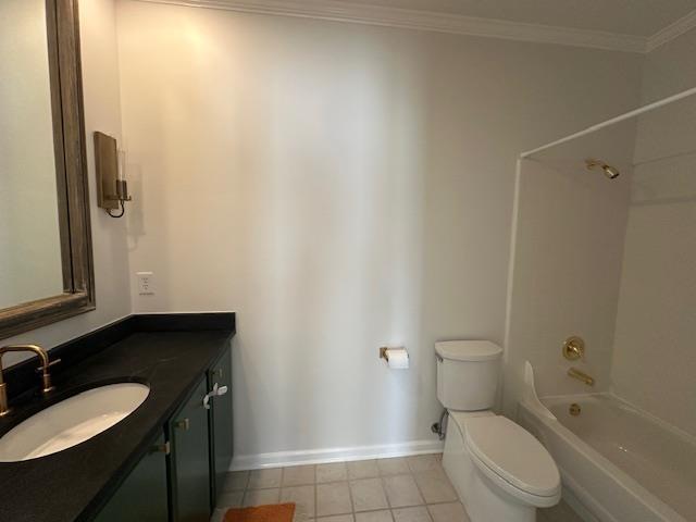 6425 Lebarrett Cv, Memphis, TN 38120 - bathroom with vanity, shower / tub combination, tile patterned flooring, and ornamental molding