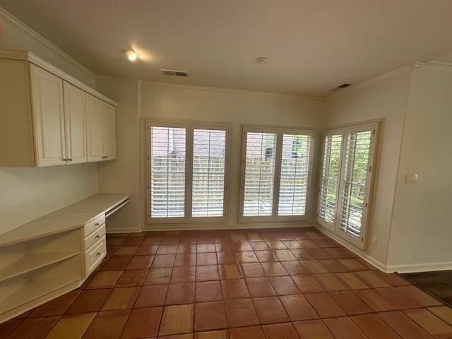 6425 Lebarrett Cv, Memphis, TN 38120 - interior space with ornamental molding, built in desk, and tile patterned flooring
