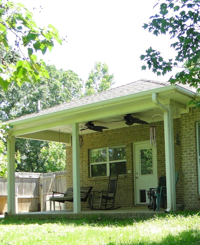 630 Ridgecrest Dr, Pope, MS 38658 - back of property featuring ceiling fan, brick siding, and a patio