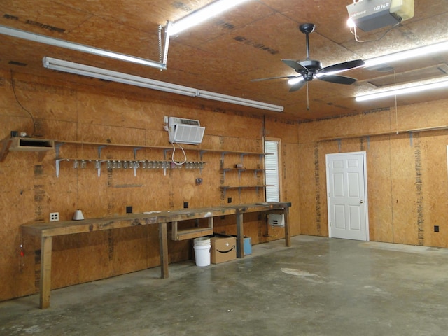 630 Ridgecrest Dr, Pope, MS 38658 - garage featuring a workshop area, a wall mounted AC, a garage door opener, and a ceiling fan