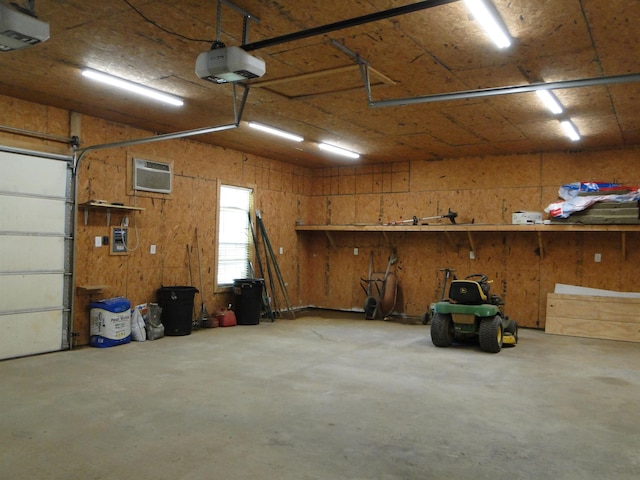 630 Ridgecrest Dr, Pope, MS 38658 - garage with a garage door opener and a wall unit AC