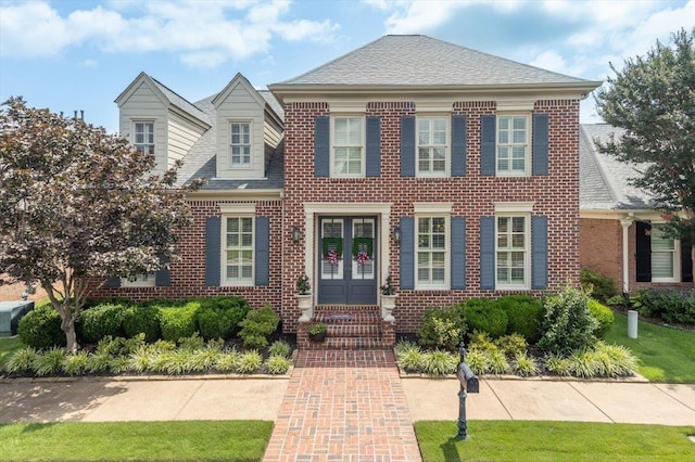 1506 Wolf Bend Rd, Germantown, TN 38138 - colonial house featuring french doors, brick siding, and roof with shingles