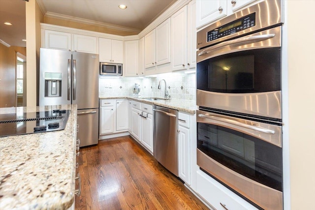 1506 Wolf Bend Rd, Germantown, TN 38138 - kitchen featuring stainless steel appliances, white cabinets, ornamental molding, light stone counters, and dark wood-style flooring