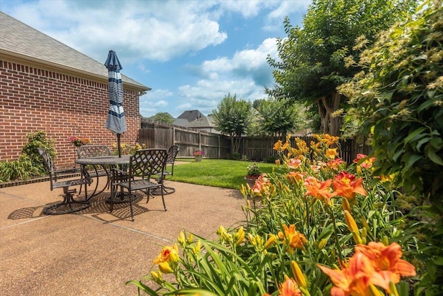 1506 Wolf Bend Rd, Germantown, TN 38138 - fenced backyard featuring a patio area and outdoor dining space