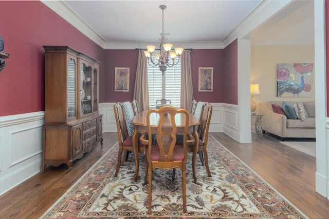 1506 Wolf Bend Rd, Germantown, TN 38138 - dining room with a chandelier, a decorative wall, wood finished floors, a wainscoted wall, and ornamental molding