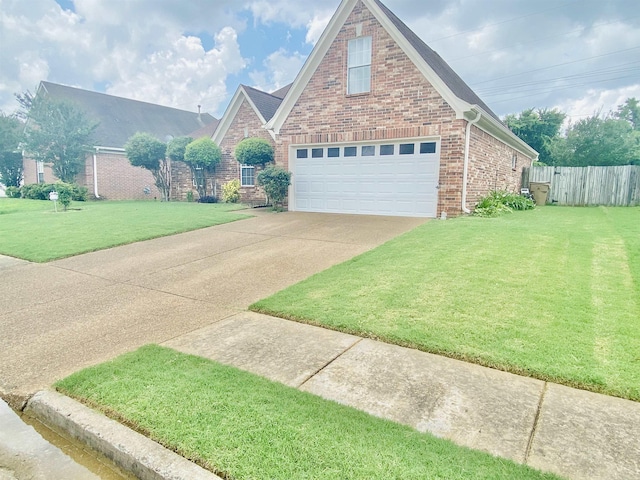 1121 W Red Fern Cir W, Cordova, TN 38018 - traditional home with brick siding, driveway, and an attached garage