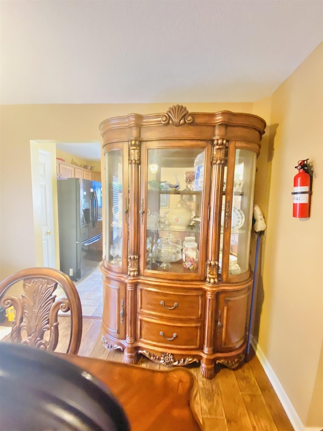 1121 W Red Fern Cir W, Cordova, TN 38018 - detailed view of stainless steel fridge with ice dispenser and wood finished floors