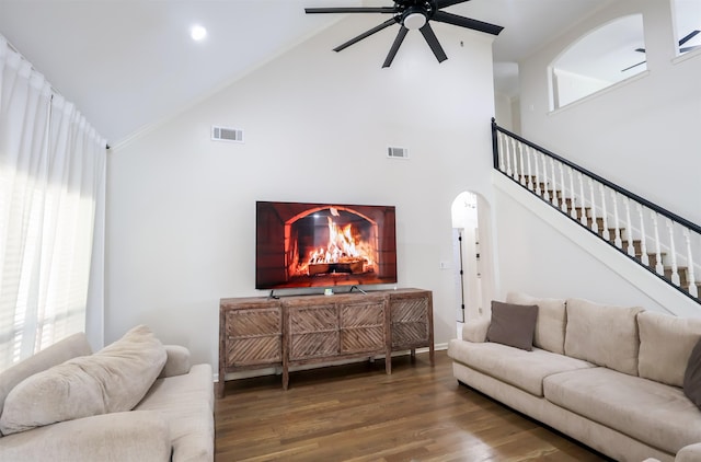 8510 Wolf Trace Ln, Bartlett, TN 38133 - living area with high vaulted ceiling, ceiling fan, wood finished floors, stairway, and arched walkways