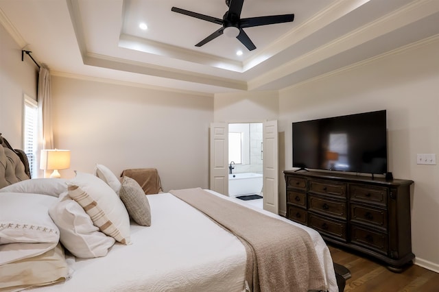 8510 Wolf Trace Ln, Bartlett, TN 38133 - bedroom featuring dark wood finished floors, ornamental molding, ensuite bath, a tray ceiling, and recessed lighting