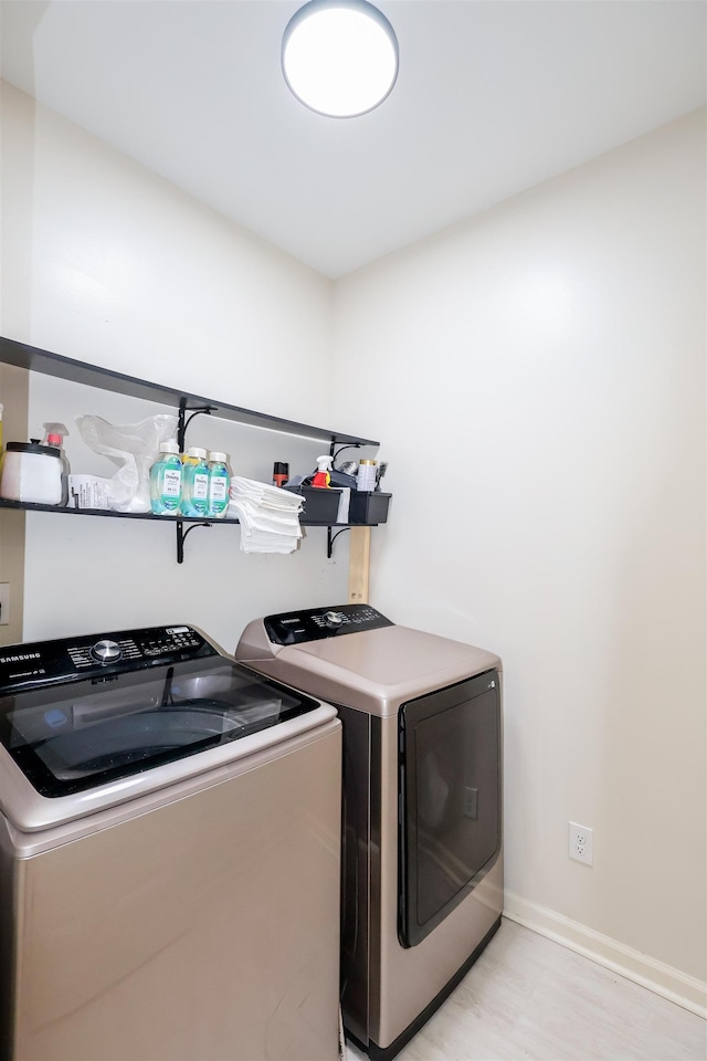 8510 Wolf Trace Ln, Bartlett, TN 38133 - washroom featuring washing machine and clothes dryer and baseboards