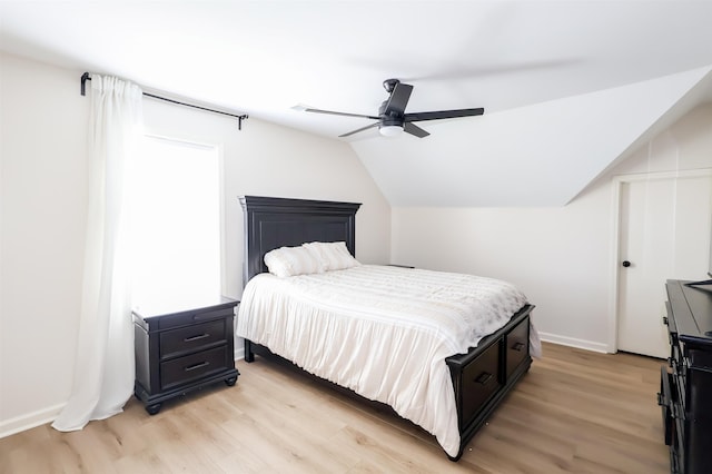 8510 Wolf Trace Ln, Bartlett, TN 38133 - bedroom with light wood-type flooring, lofted ceiling, and a ceiling fan