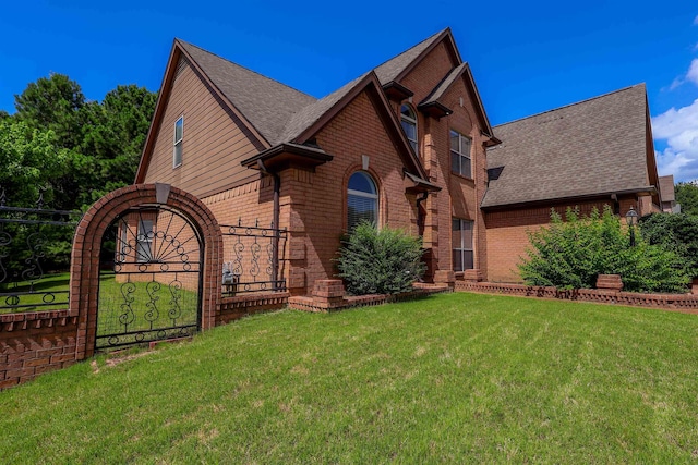8510 Wolf Trace Ln, Bartlett, TN 38133 - view of front facade with brick siding, roof with shingles, and a front lawn