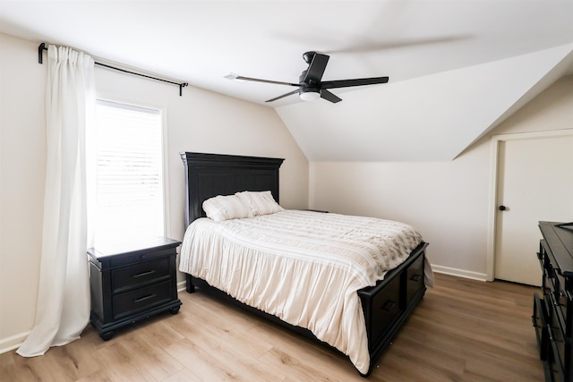 8510 Wolf Trace Ln, Bartlett, TN 38133 - bedroom with light wood finished floors, vaulted ceiling, and ceiling fan