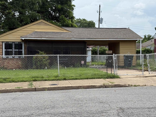 1493 Ragan St, Memphis, TN 38106 - view of home's exterior featuring roof with shingles and a gate