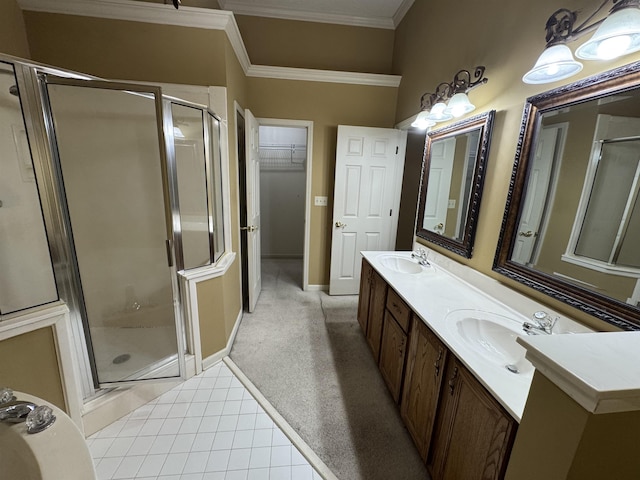 850 N Ericson Rd, Memphis, TN 38018 - full bath featuring a shower stall, ornamental molding, double vanity, tile patterned flooring, and a walk in closet