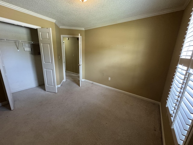 850 N Ericson Rd, Memphis, TN 38018 - unfurnished bedroom with a textured ceiling, ornamental molding, light carpet, and a closet