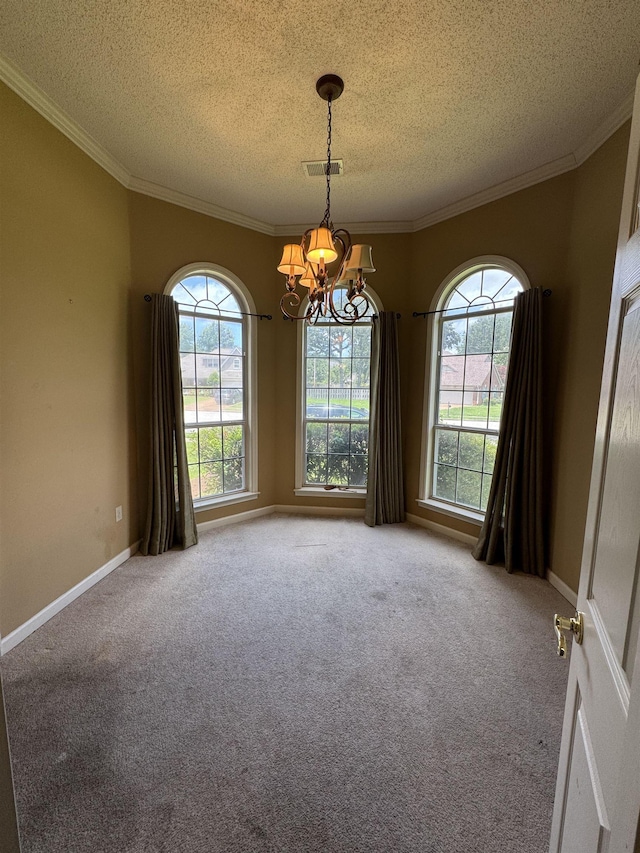850 N Ericson Rd, Memphis, TN 38018 - empty room featuring a chandelier, a textured ceiling, plenty of natural light, carpet floors, and ornamental molding