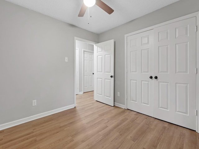 1438 Silver St, Memphis, TN 38106 - unfurnished bedroom featuring light wood finished floors, a closet, and a ceiling fan