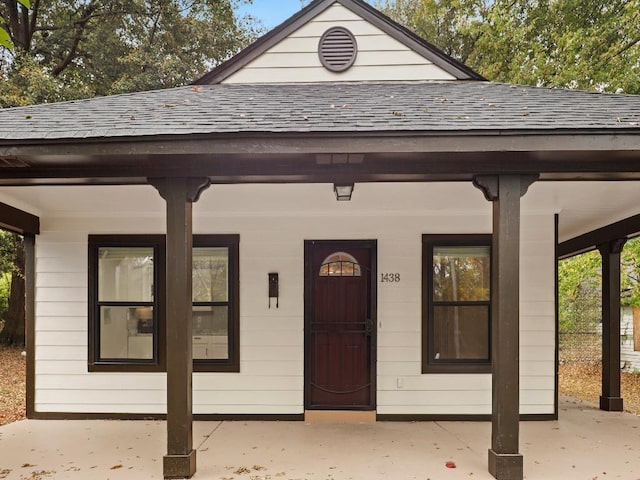 1438 Silver St, Memphis, TN 38106 - property entrance with roof with shingles and covered porch