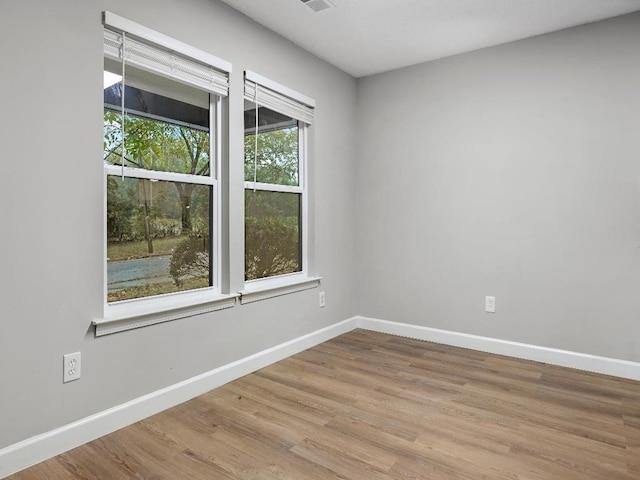 1438 Silver St, Memphis, TN 38106 - empty room featuring baseboards and wood finished floors