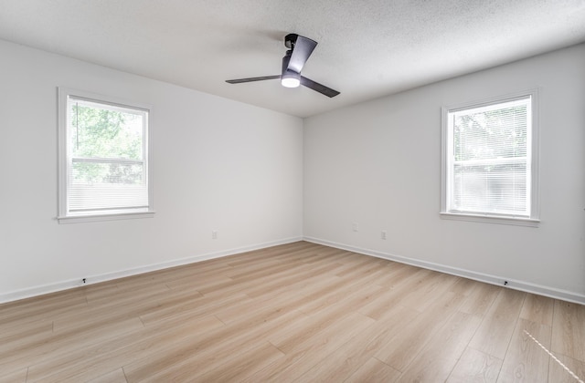 3693 Socorro Cv, Memphis, TN 38128 - spare room featuring light wood-style flooring, ceiling fan, and a textured ceiling
