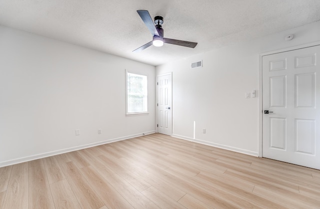 3693 Socorro Cv, Memphis, TN 38128 - unfurnished bedroom with light wood-style flooring, a textured ceiling, and ceiling fan