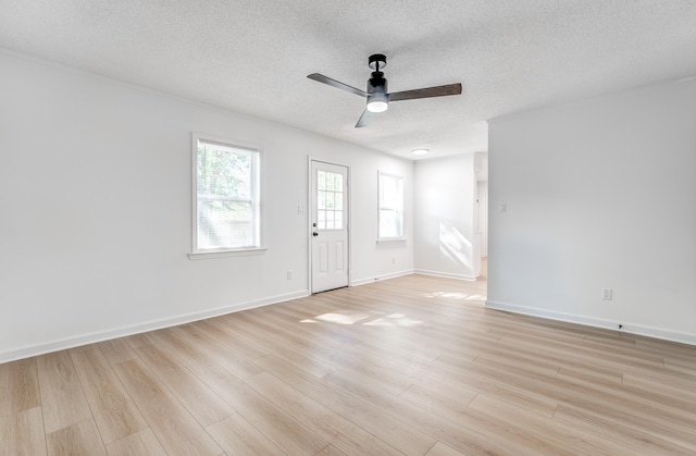 3693 Socorro Cv, Memphis, TN 38128 - unfurnished room with a textured ceiling, ceiling fan, and light wood-style flooring
