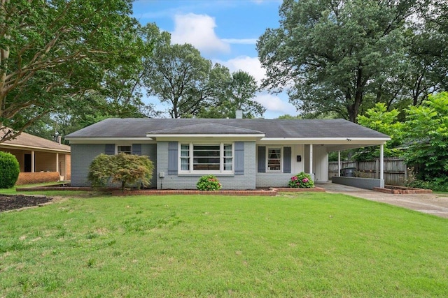 4583 E Dearing Rd, Memphis, TN 38117 - ranch-style home with a carport, driveway, and brick siding