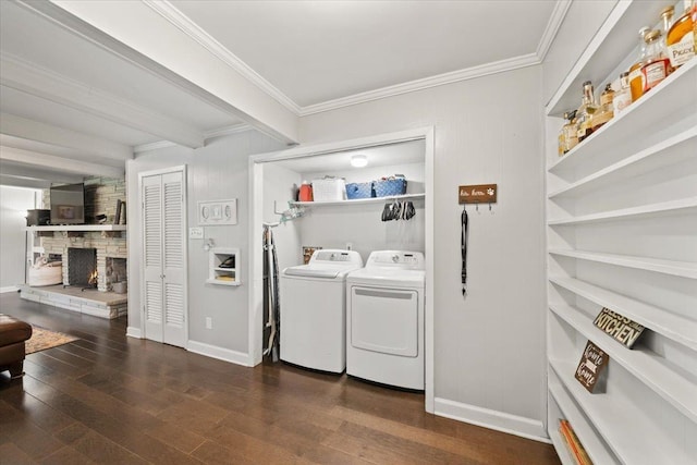 4583 E Dearing Rd, Memphis, TN 38117 - washroom with washing machine and clothes dryer, ornamental molding, and wood finished floors