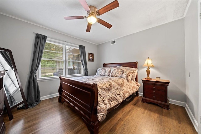 4583 E Dearing Rd, Memphis, TN 38117 - bedroom featuring dark wood finished floors, crown molding, and a ceiling fan