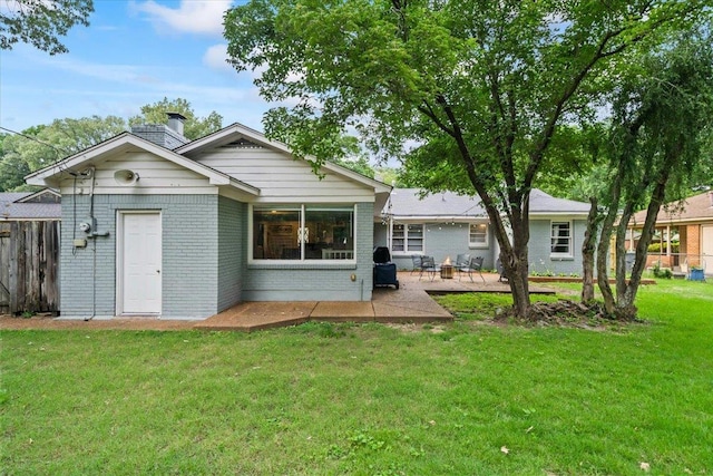 4583 E Dearing Rd, Memphis, TN 38117 - back of house with brick siding, a patio area, and a chimney
