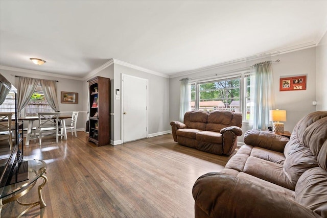 4583 E Dearing Rd, Memphis, TN 38117 - living area featuring wood finished floors, plenty of natural light, and ornamental molding