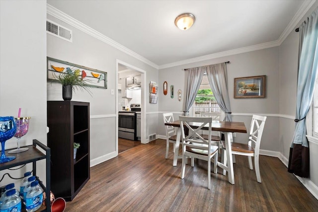 4583 E Dearing Rd, Memphis, TN 38117 - dining room with dark wood finished floors and ornamental molding