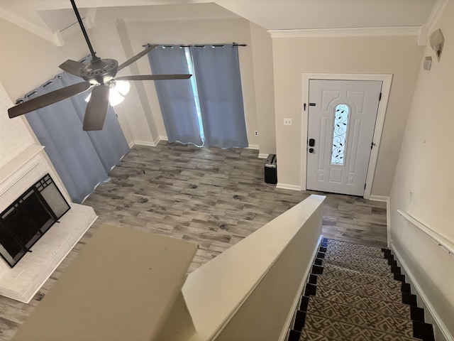 8894 Lake Edge Cv, Memphis, TN 38016 - entryway featuring wood finished floors, a ceiling fan, and crown molding
