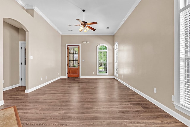 6836 Lagrange Grove Dr, Cordova, TN 38018 - unfurnished room featuring a ceiling fan, arched walkways, dark wood-type flooring, and crown molding
